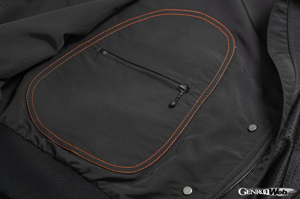 ロータスの次世代EVハイパーカー、エヴァイヤのオーナーのために生まれたノートン&サンズのドライビングジャケット。ポケット