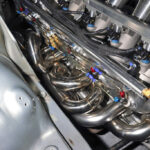 「「このエンジンルームは衝撃的すぎる・・・」6ローター仕様のユーノスコスモ、爆誕！【東京オートサロン2022】」の14枚目の画像ギャラリーへのリンク