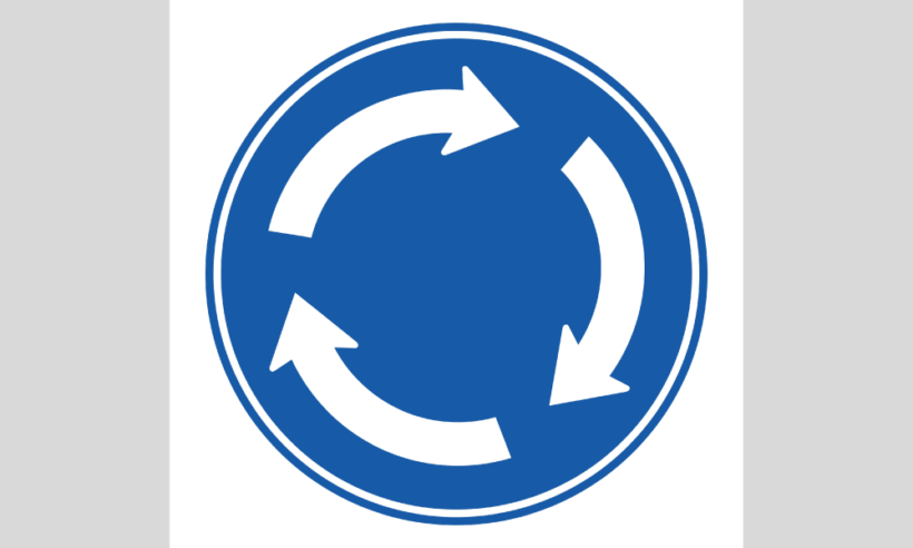 「環状交差点通行方法」の標識